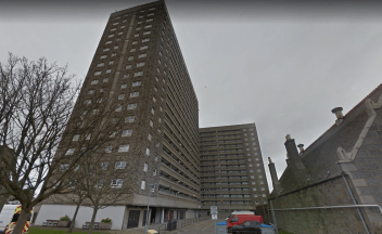 Investigation after man found seriously injured in flat stairwell