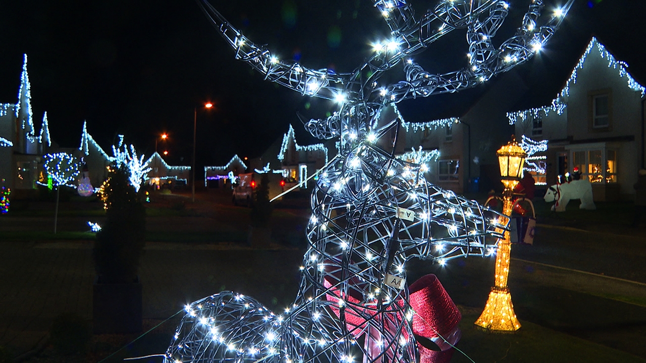 The decorations are lighting up the night in the Newton Mearns street.