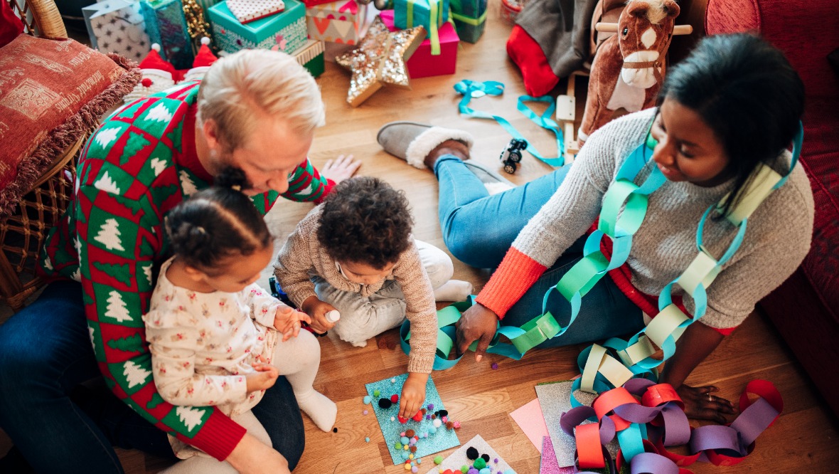 Family making paper chains at Christmas 