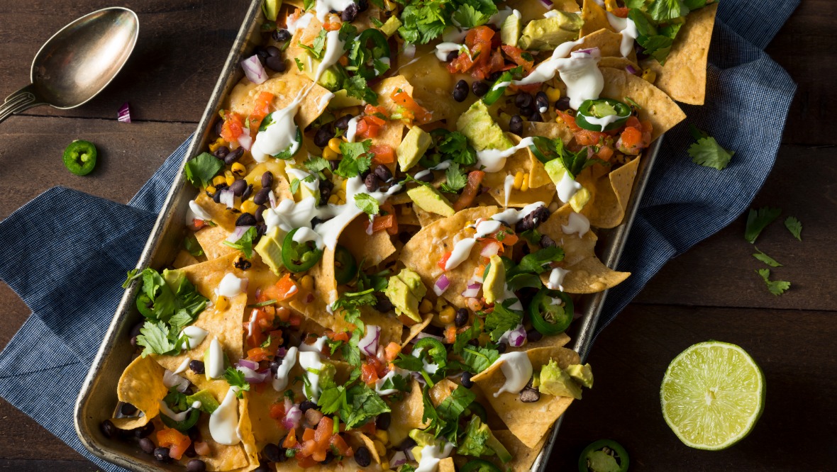 Leftover turkey or ham can be scattered over a warming plate of nachos.