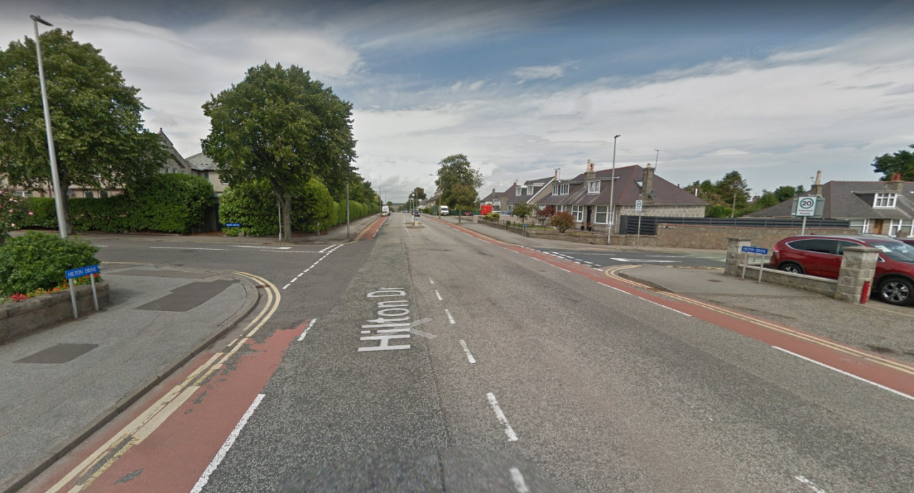 Driver dies in two-car collision as two men flee crash scene