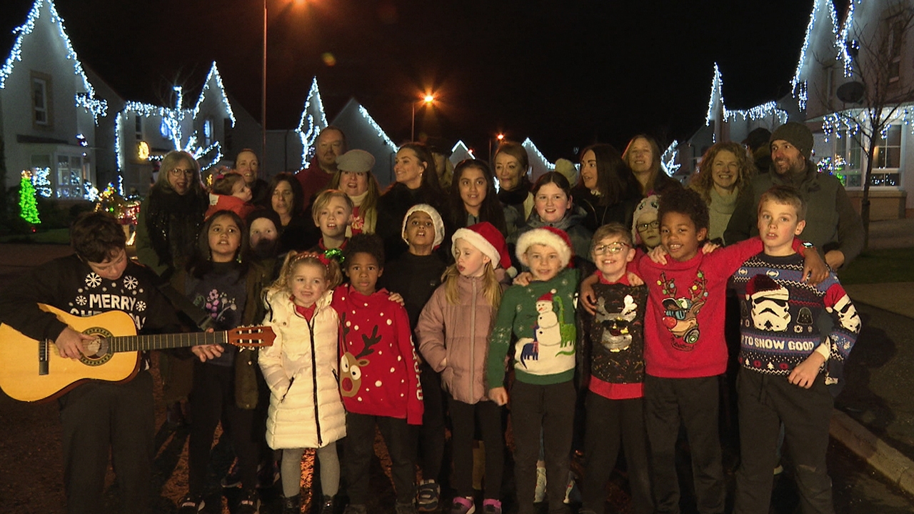 Neighbours came out to single Jingle Bells during the big switch-on.