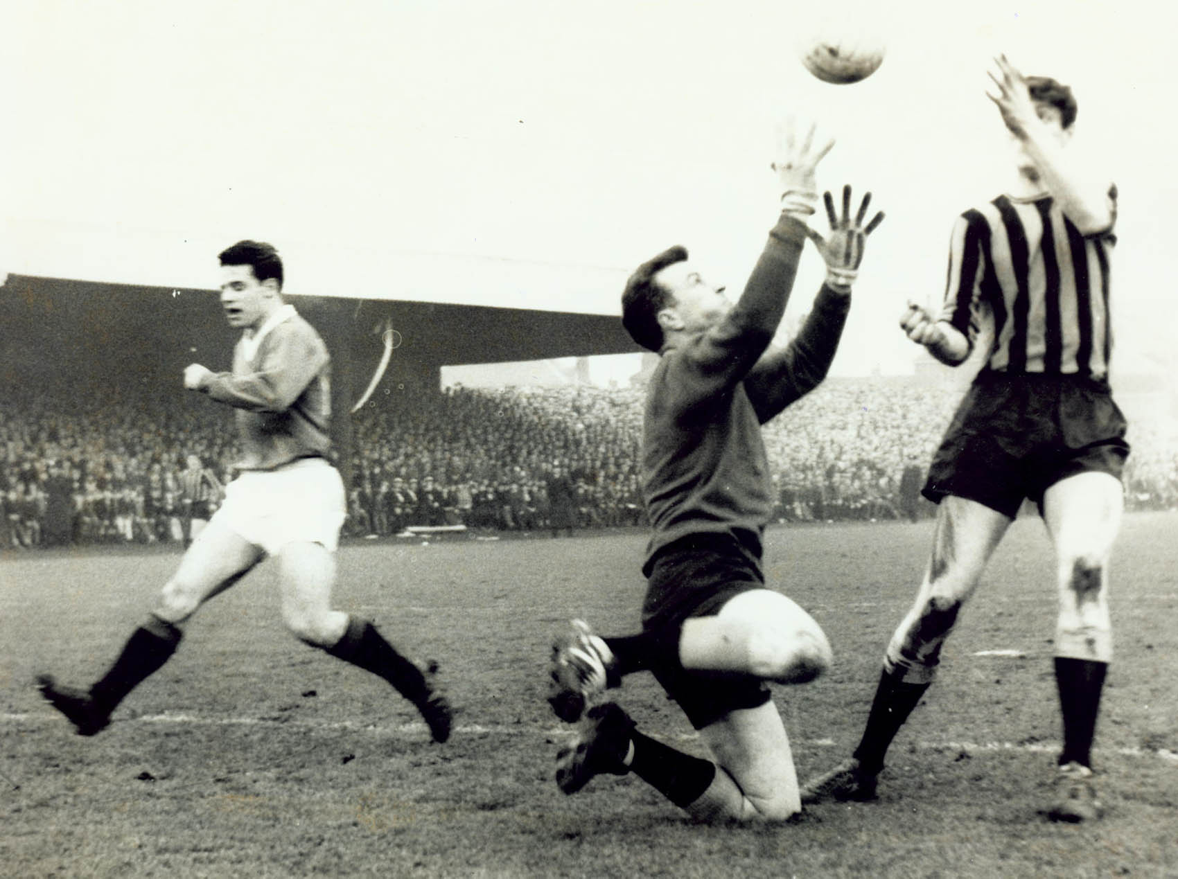 Berwick keeper Jock Wallace and stopper Doug Coutts combine to snuff out the danger of Rangers' Jim Forrest.