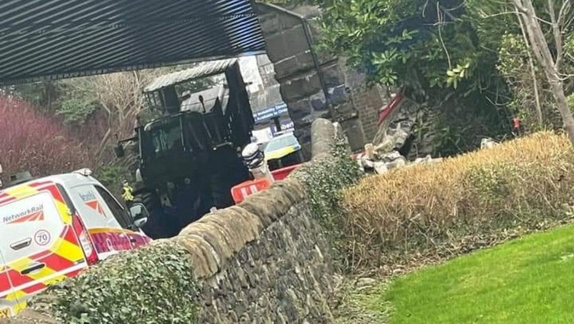 Woman charged after tractor gets stuck under railway bridge