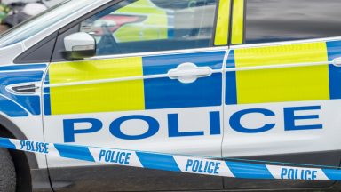 Stock image of police car and police tape, Police Scotland.
