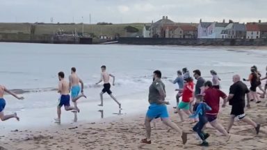 Hundreds of Scots brave the cold for Loony Dook dips