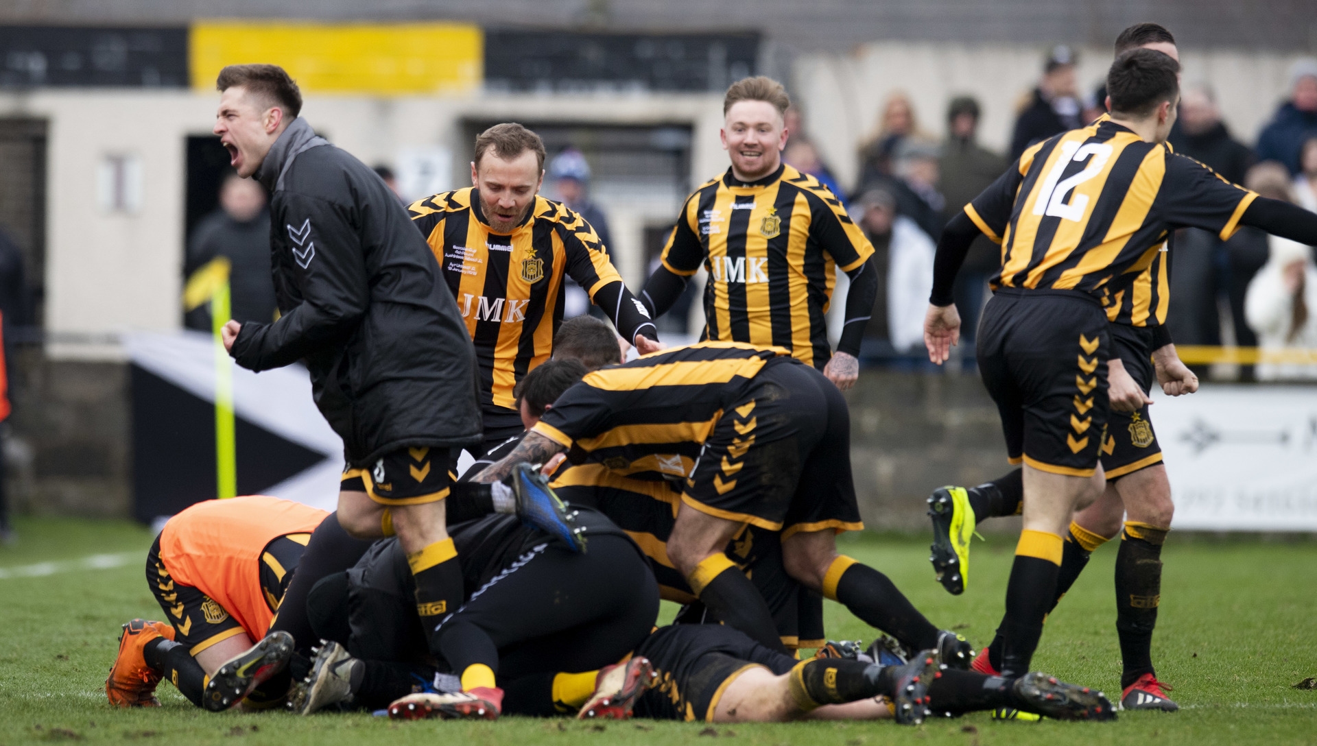 The Talbot players celebrate Craig McCracken's winning goal.