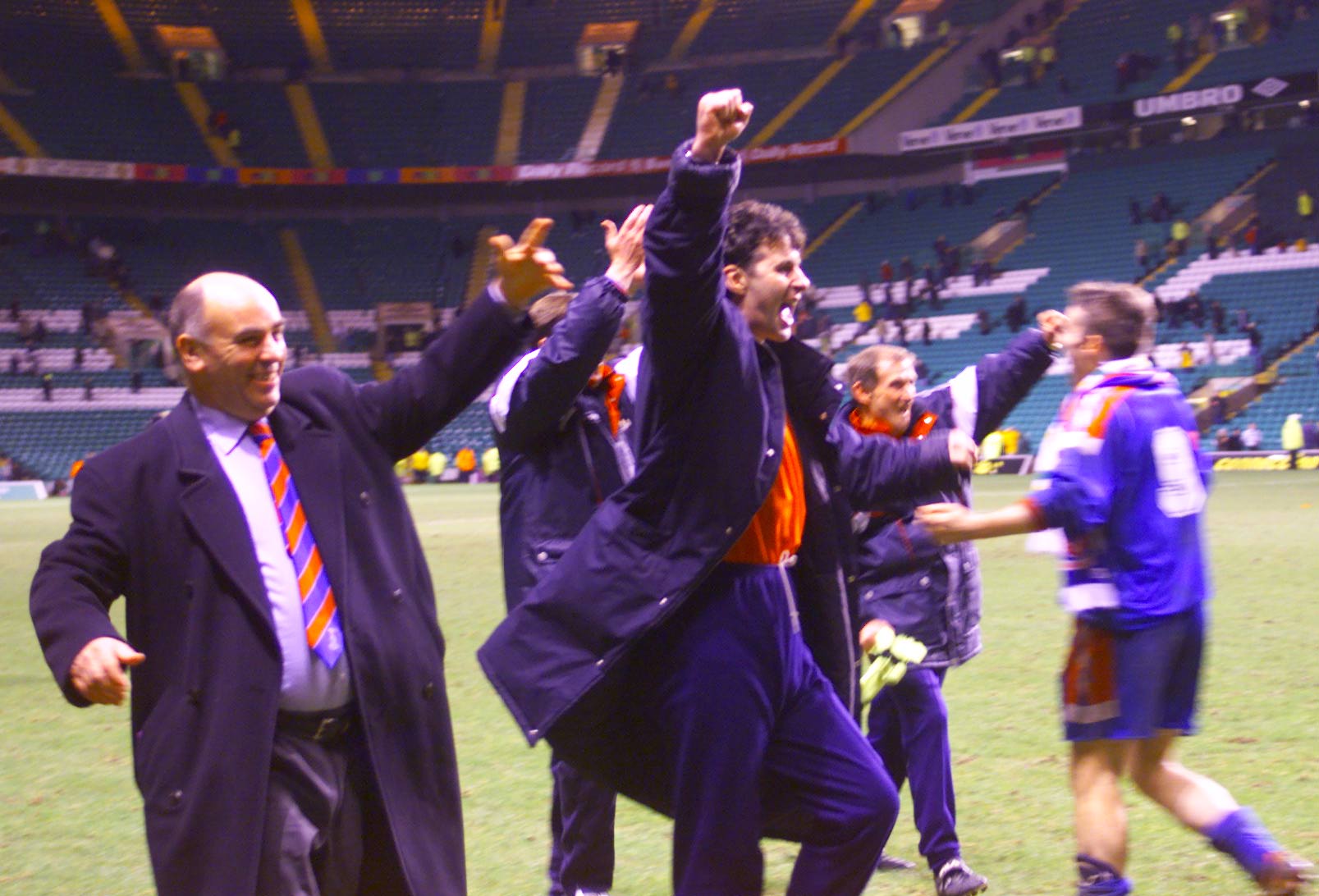 John Sutherland, the Inverness general manager, salutes the crowd after a stunning win.