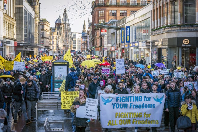 People march down Argyle Street (Jane Barlow/PA)