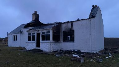 Couple flee Lewis house fire in pyjamas after lightning strike destroys house
