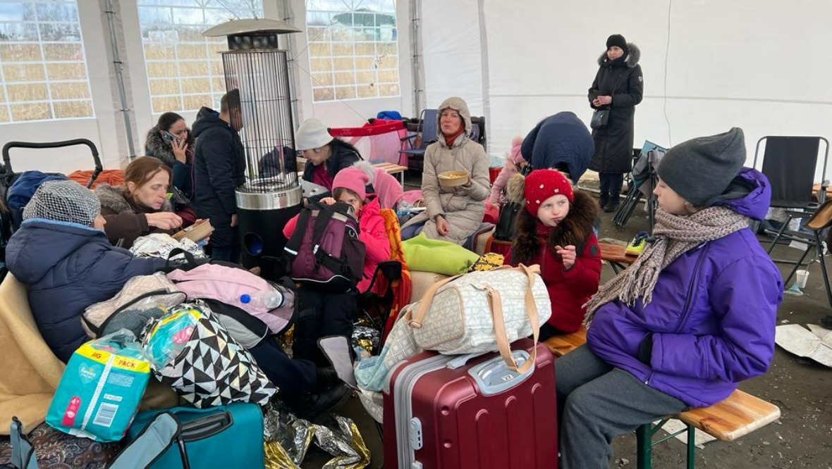 Ukrainians arriving in Medyka, Poland, on Tuesday.