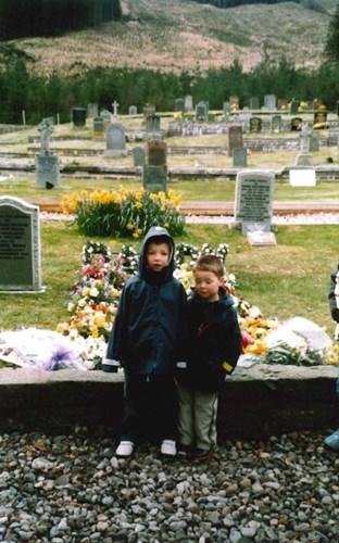 Andrew Wilson and his brother at his father's graveside.