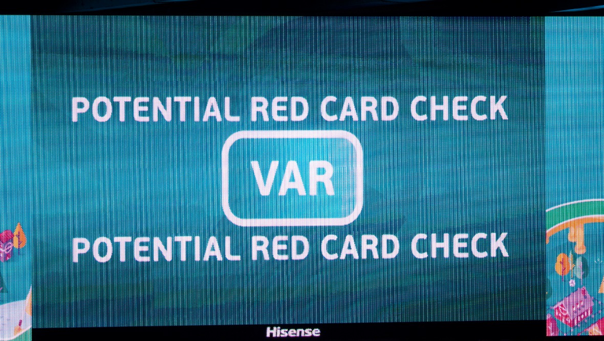 Big screens tell fans a VAR check is underway during a Euro 2020 match at Hampden.