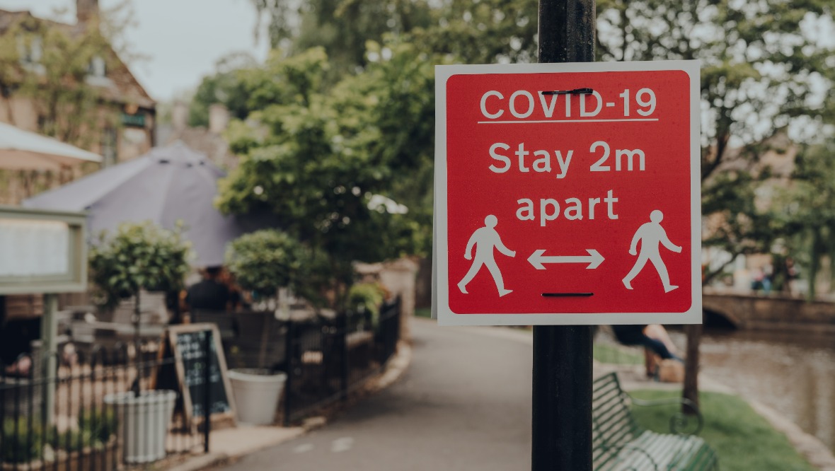 Stock image of a Covid sign to stay 2m apart.