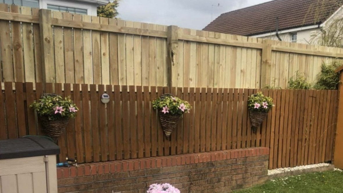 Resident wins planning fight to keep fence after Glasgow City Council ordered it to be torn down