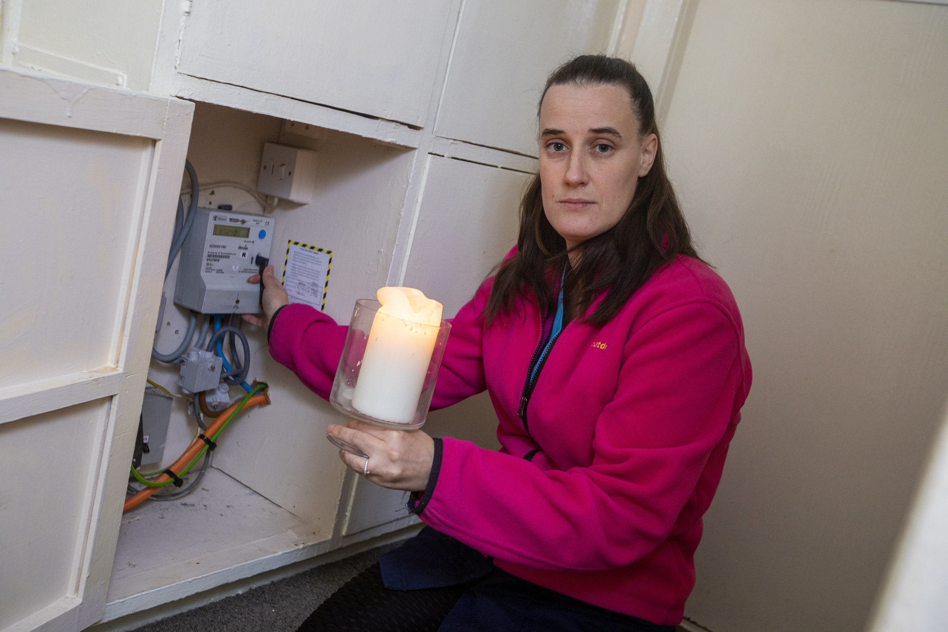 The cleaner spends the majority of her salary towards her electricity meter.