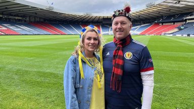 Husband with Tartan Army as wife sits in Ukraine end at Hampden for World Cup play-off in Glasgow