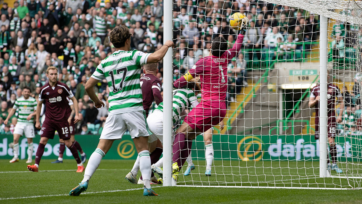 Hearts' goalkeeper Craig Gordon can't keep Kyogo's header from going over the line to make it 2-1.