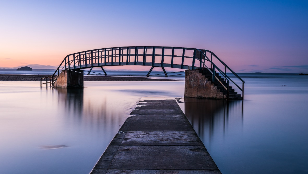 Belhaven Bridge appears to show a footbridge to nowhere during high tide. 