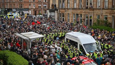 Three people to stand trial following protest on Kenmure Street in Pollockshields, Glasgow
