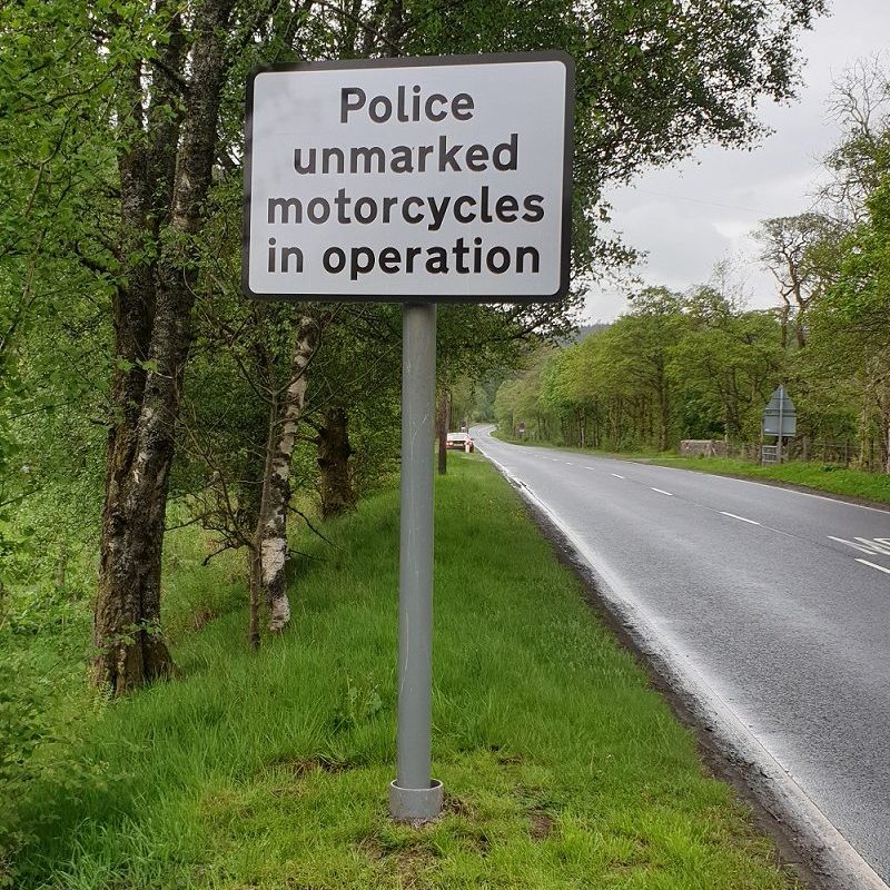Signs informing motorists that unmarked vehicles are patrolling as part of Operation Dogma. 