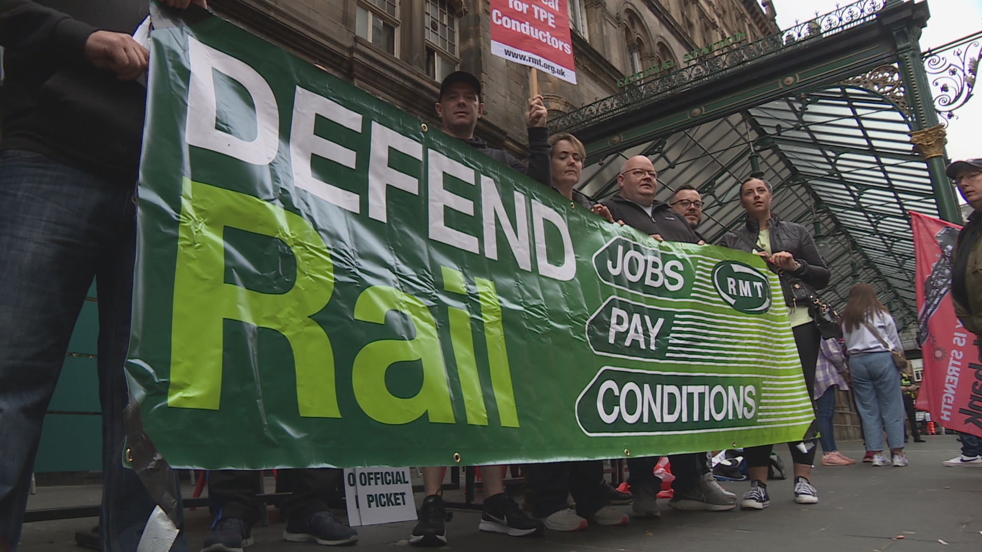 Striking rail workers outside Glasgow's Central Station.