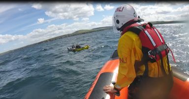 Young kayakers rescued after inflatable craft is blown out to sea 