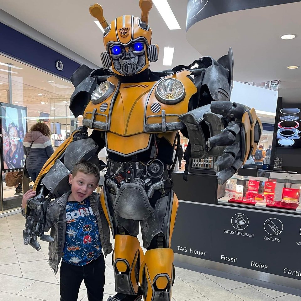 Comic Con: Young fan with Transformer.