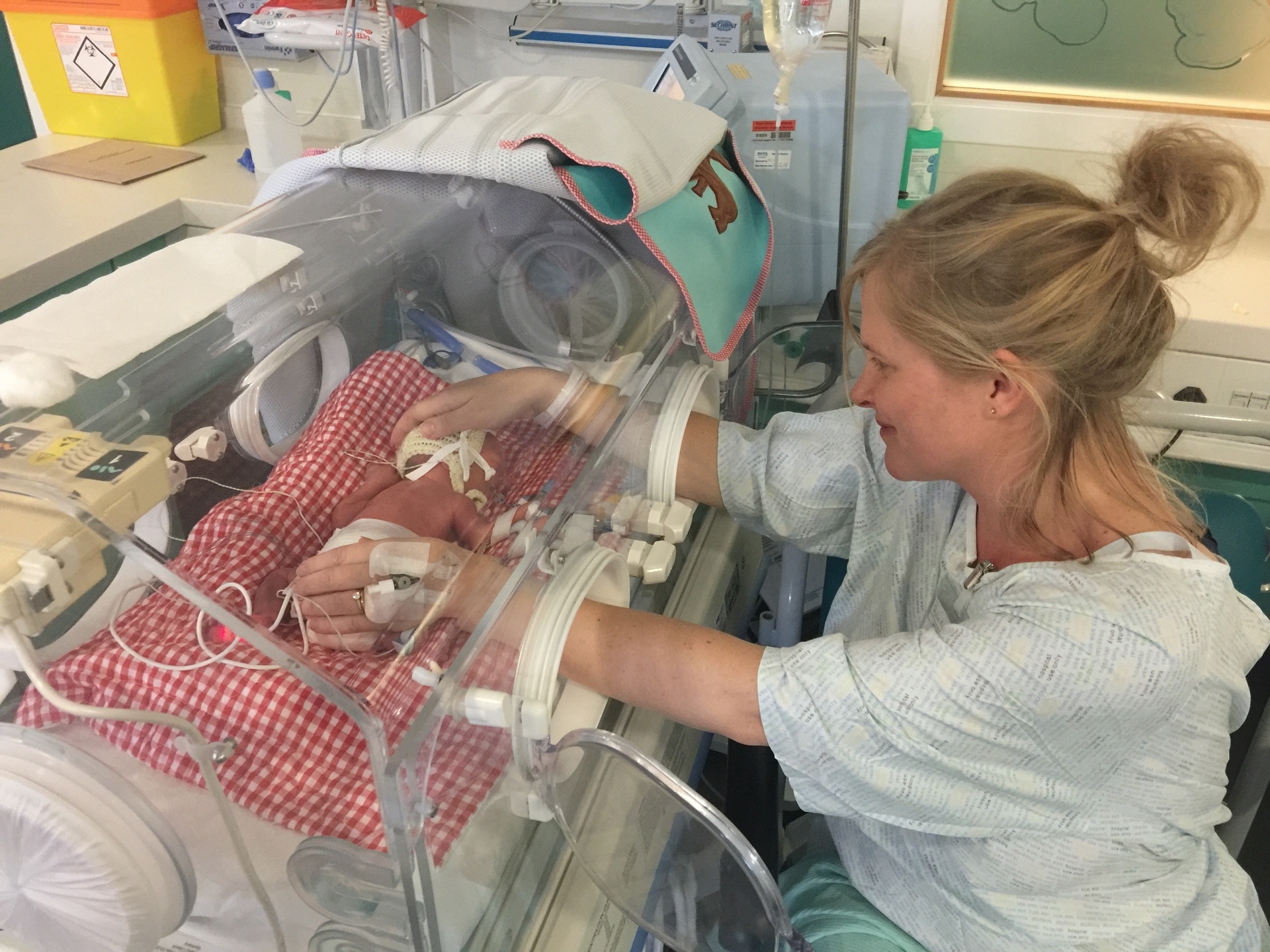 Charlie in the incubator with his mum Helen. 