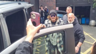 Johnny Depp arrives in Glasgow on Jeff Beck UK Isolation tour after winning case against Amber Heard