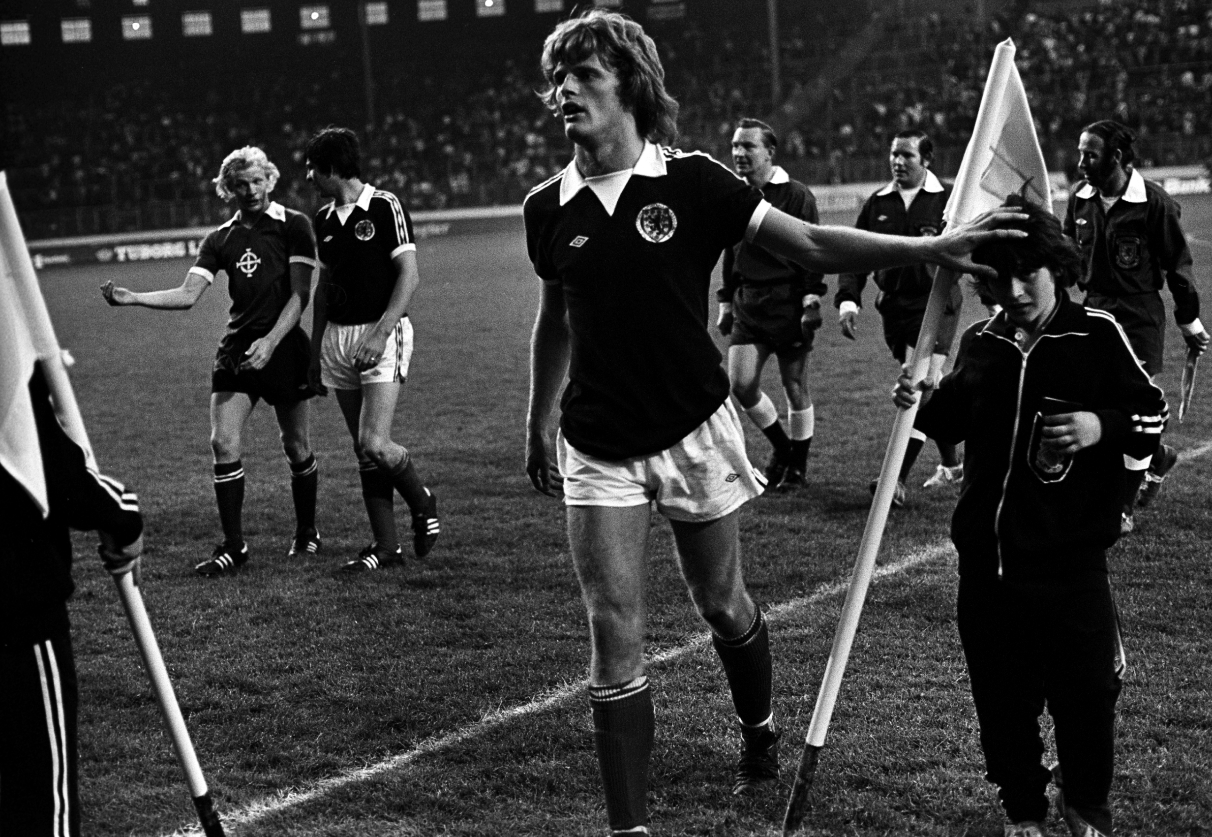 A ball boy wins some praise from McQueen after Scotland beat Northern Ireland 3-0 at Hampden in 1977.