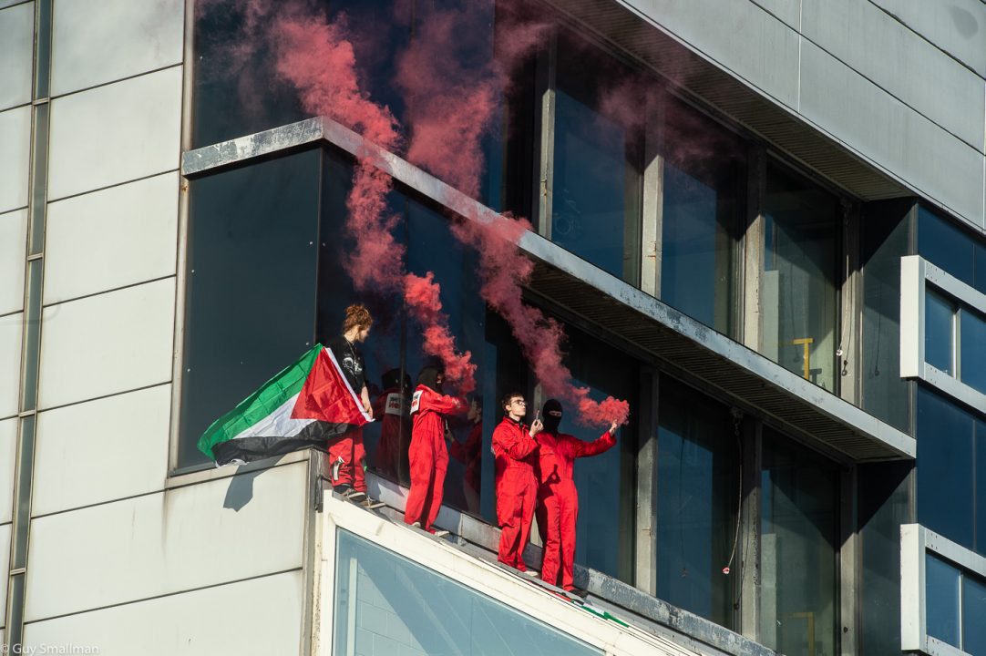Workers forced to evacuate as activists protest on roof of Thales arms factory used to produce military drones and armoured vehicles in Glasgow