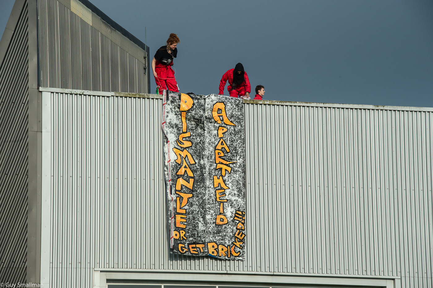 Protesters: Activists on roof of Thales factory.