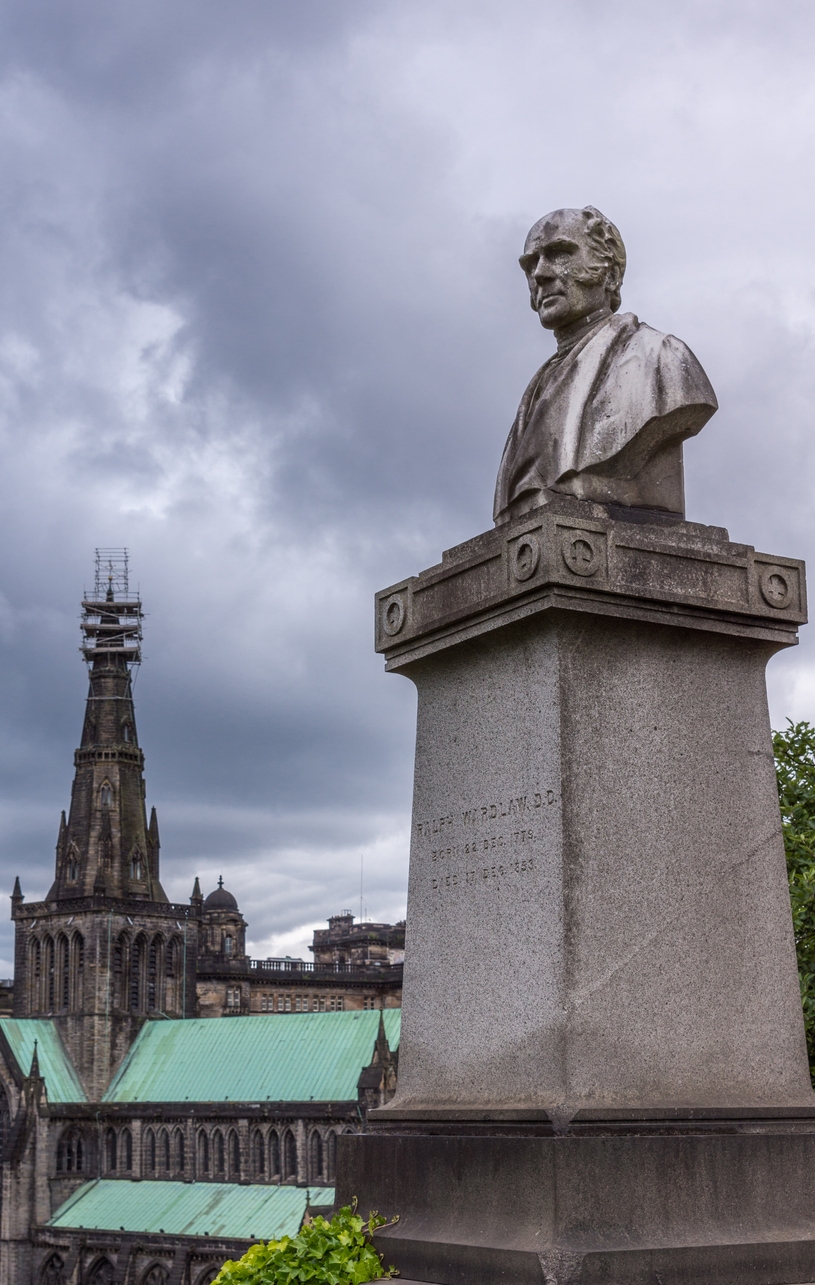  Ralph Wardlaw tombstone with his bust and the Cathedral spire behind.