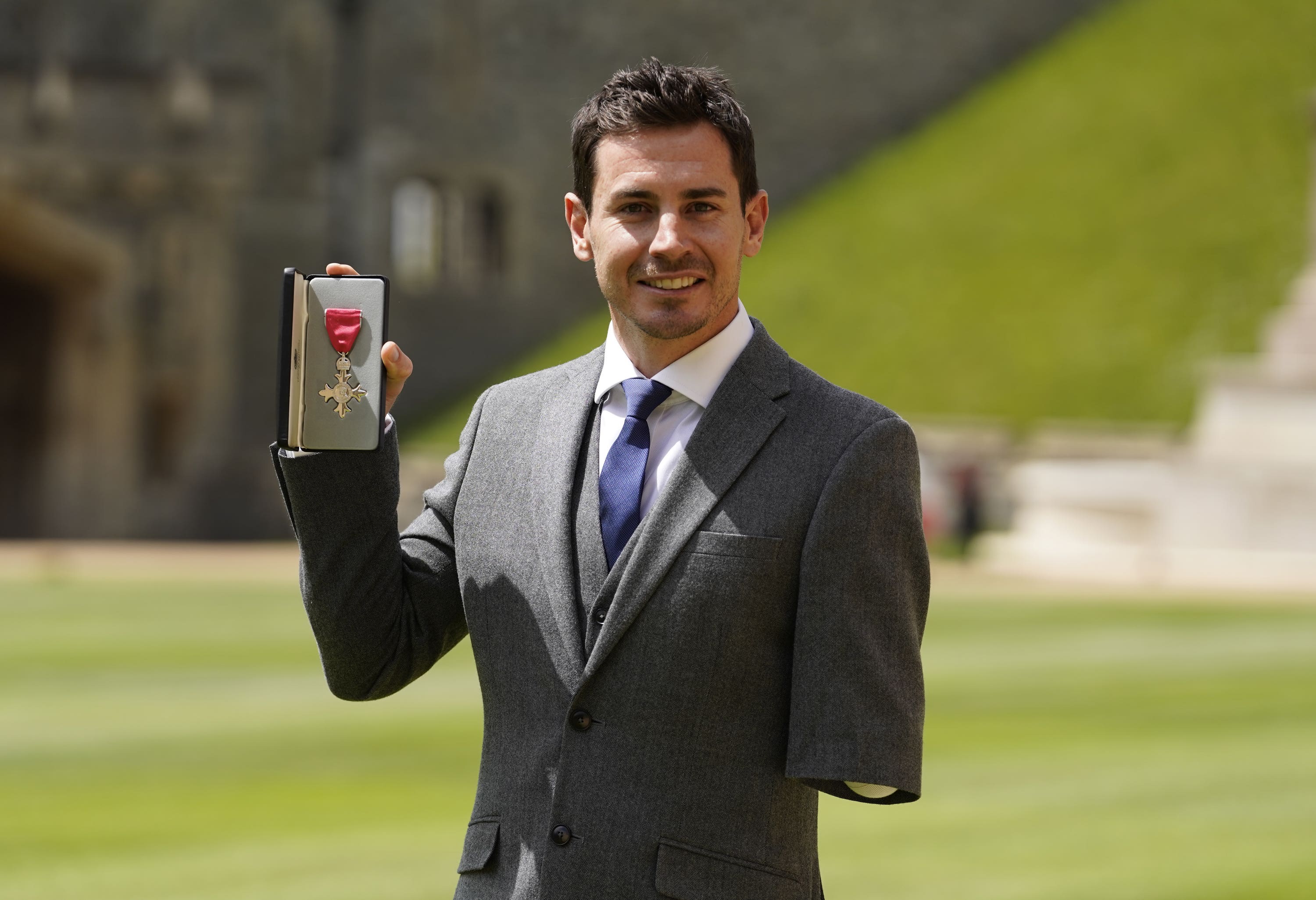 Jaco van Gass with his MBE following an investiture ceremony at Windsor Castle.