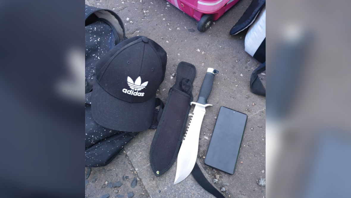 A knife and drugs were found in the car after a search.