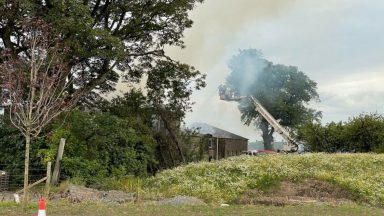 Fire crews attend blaze after smoke spotted billowing from building