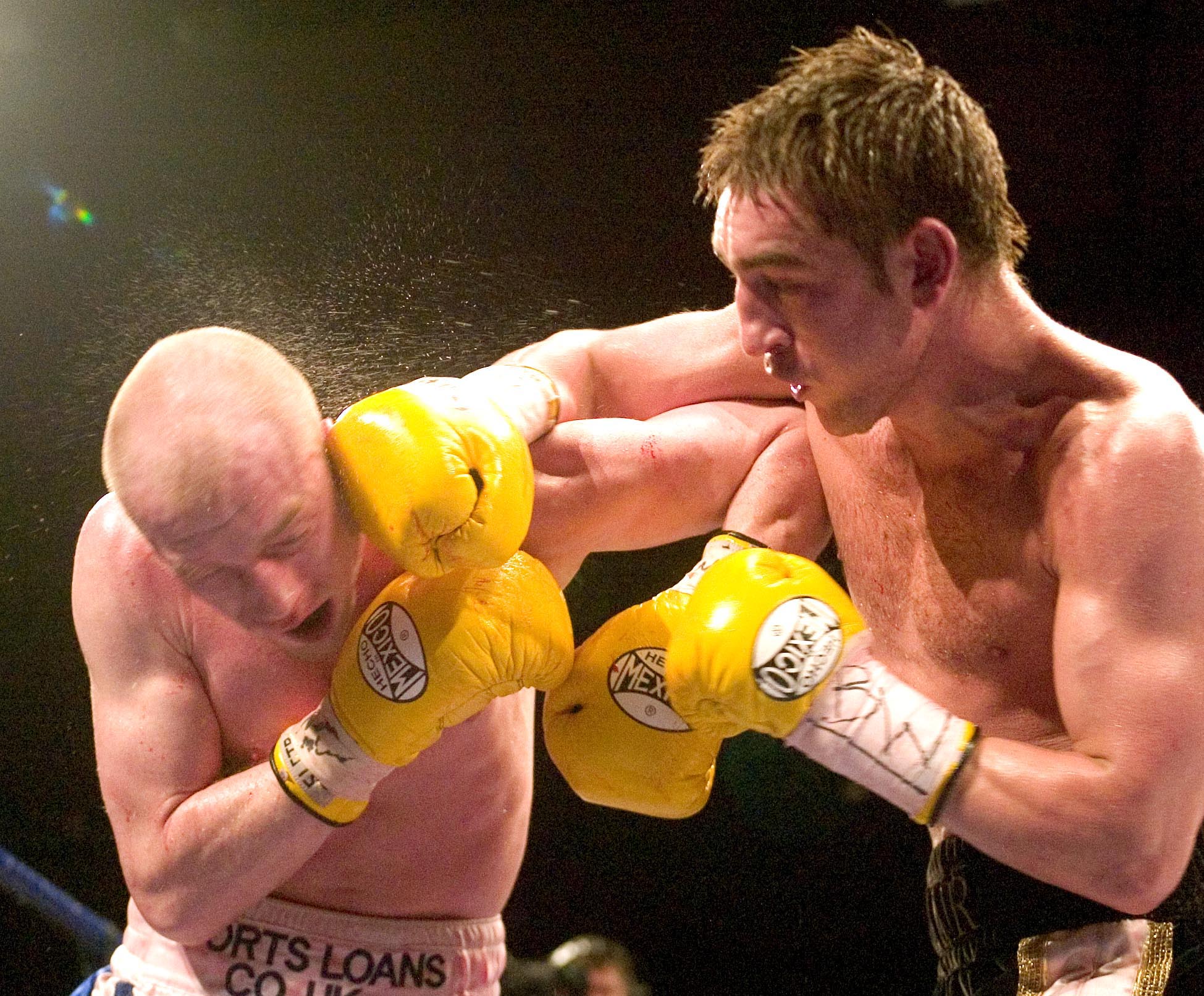 Alex Arthur lands a firm punch to the head of Craig Docherty during a Commonwealth and British super-featherweight bout in 2005.