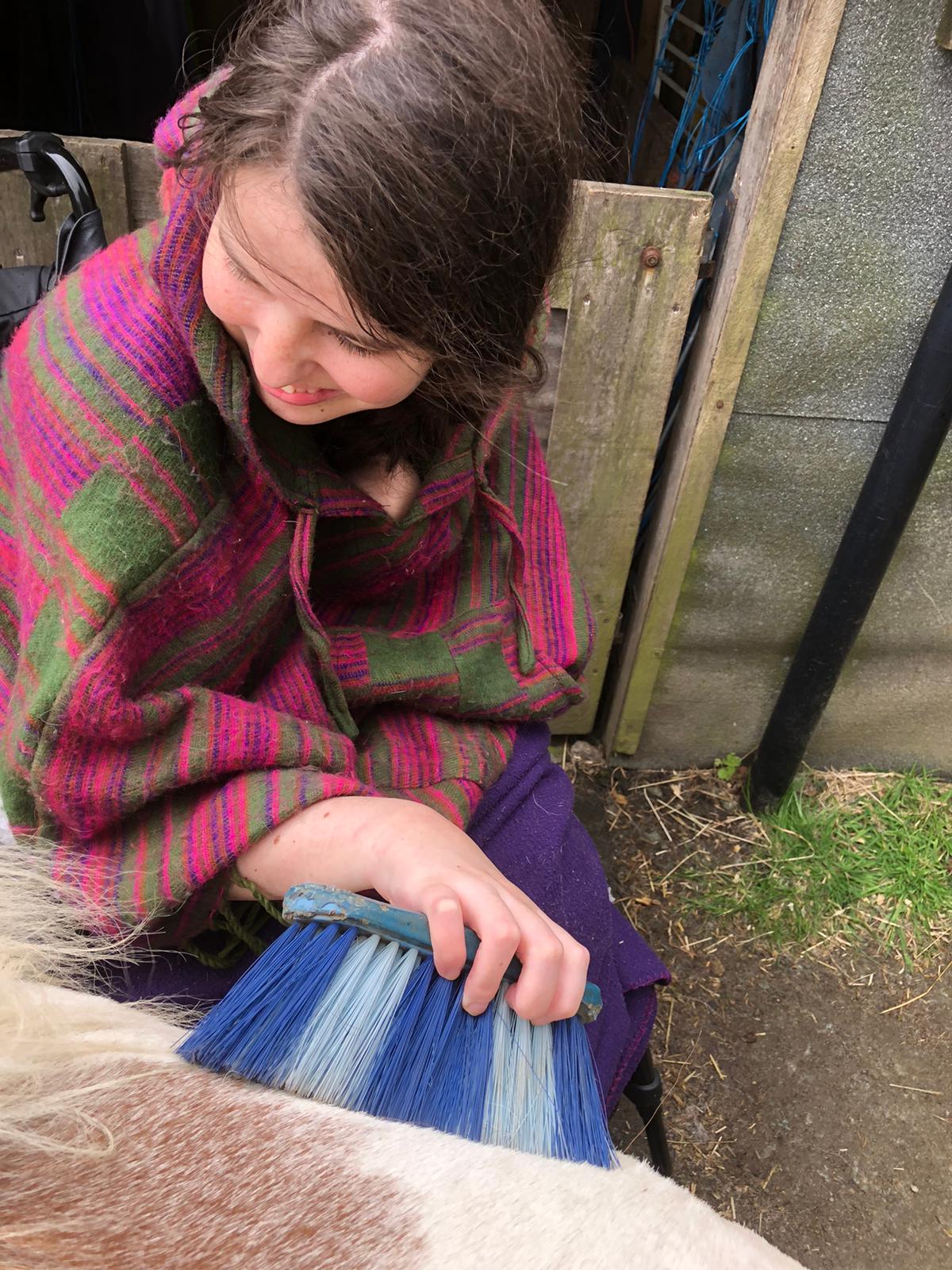 Jamie recently met one of her goals to brush a pony again