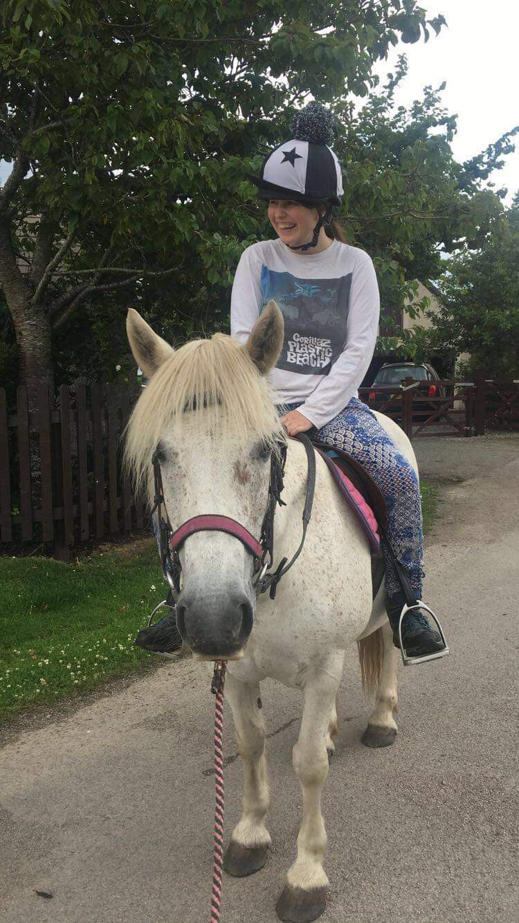 Jamie riding her horse Cameron 
