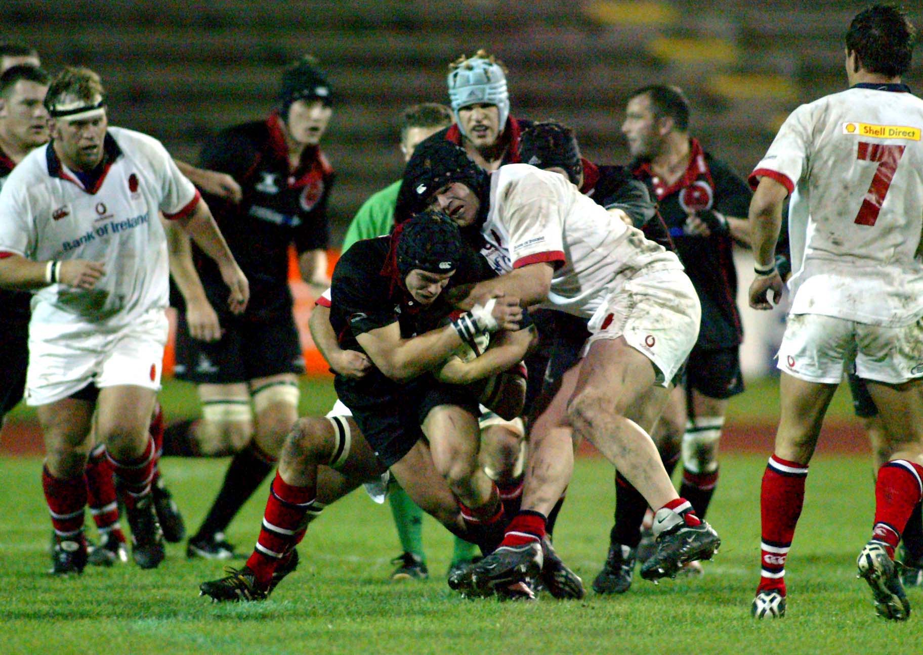 Edinburgh's Tom Philip and Matt Mustchin of Ulster battle for possession during a Celtic League clash in 2003.