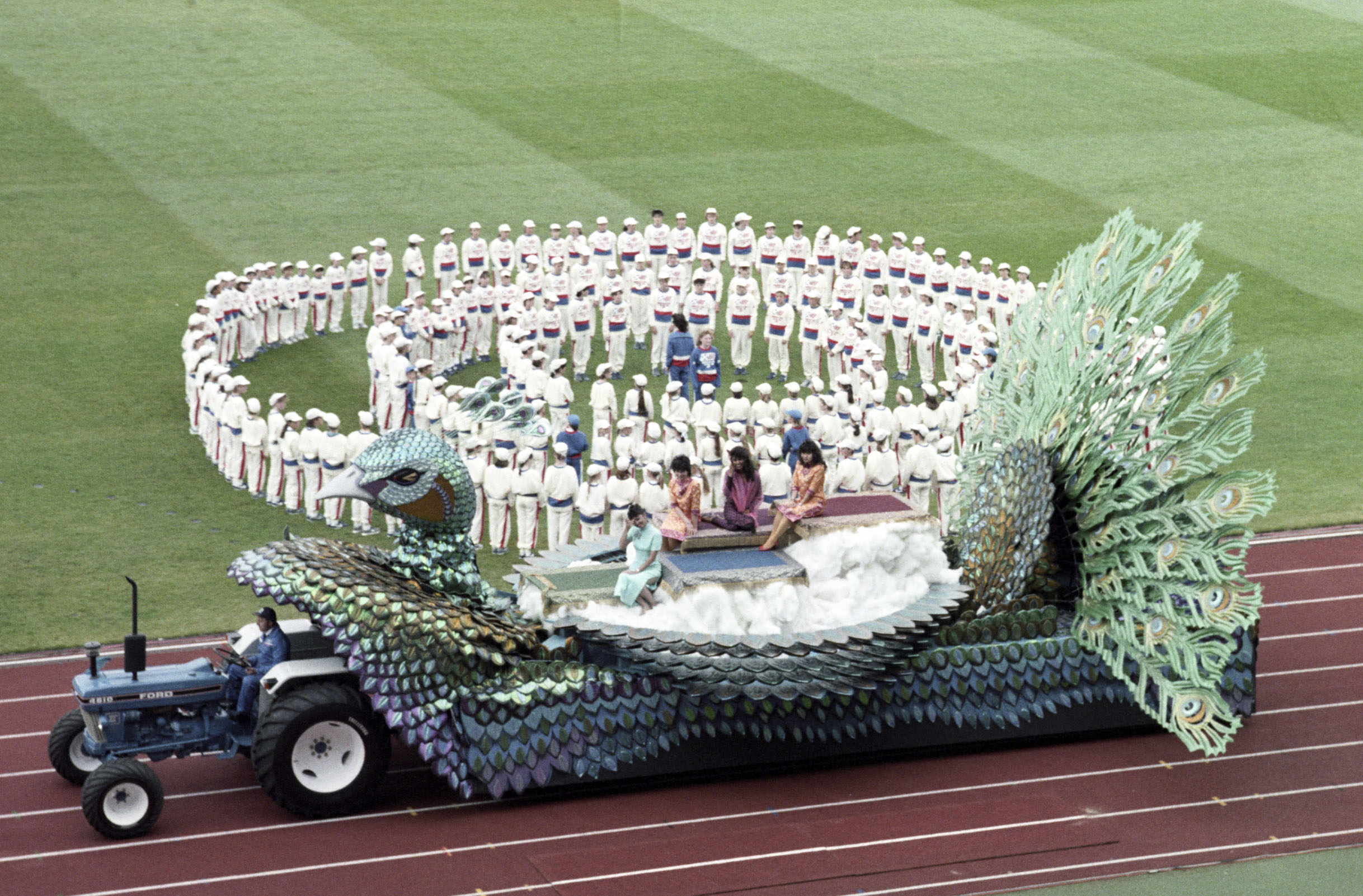 One of the attractions rolls around the athletics track as the curtain fell on the 1986 Games.