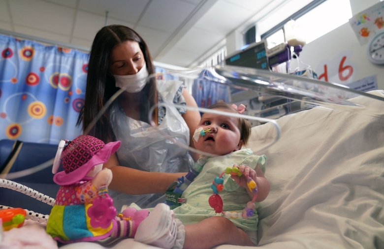 Leyla Bell, 10 months, with her mother Savana at the Freeman Hospital in High Heaton, Newcastle Upon Tyne.