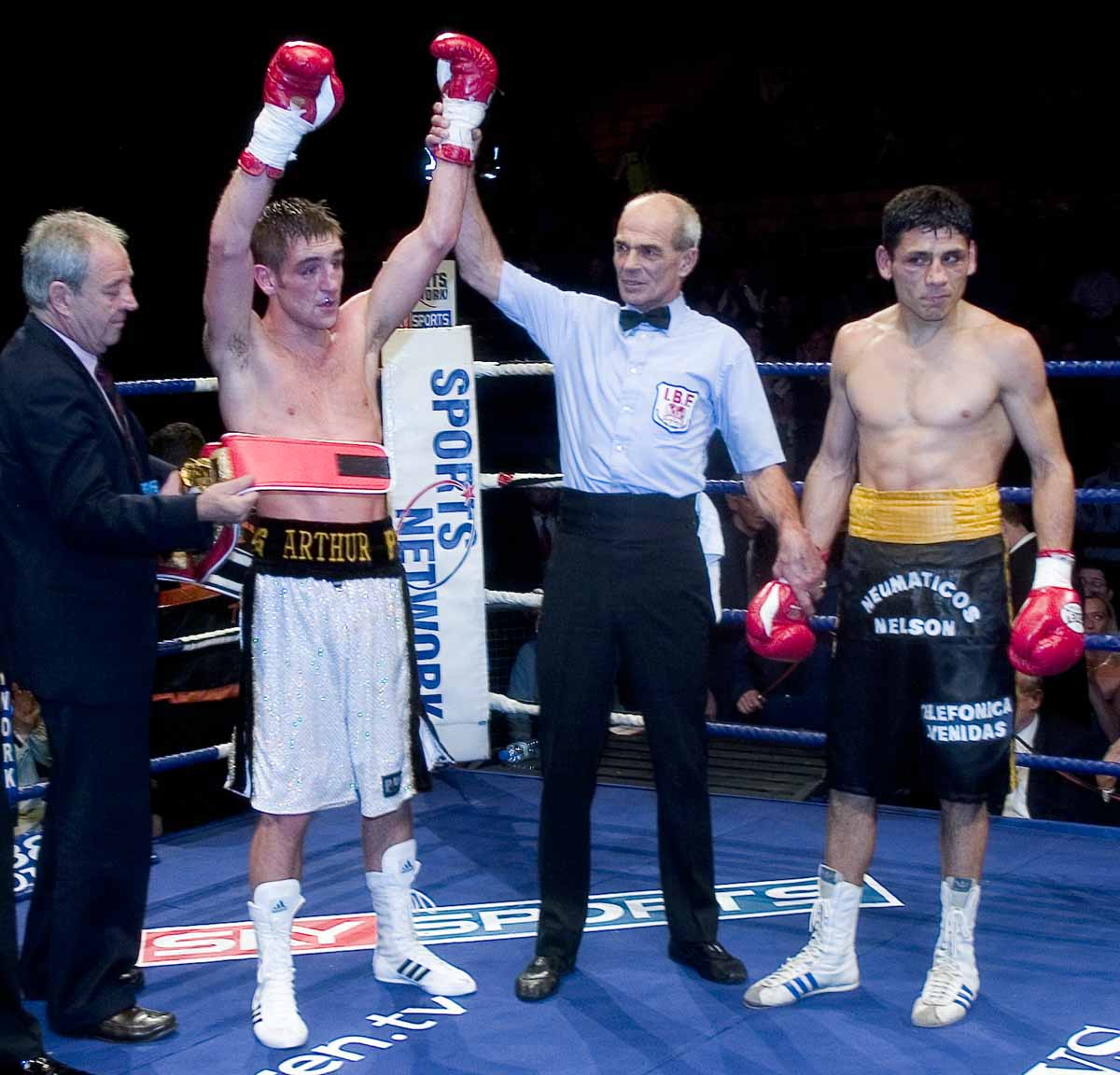 Arthur is pronounced winner after his IBF Intercontinental super-featherweight championship battle with Nazarenzo Gaston in 2004.