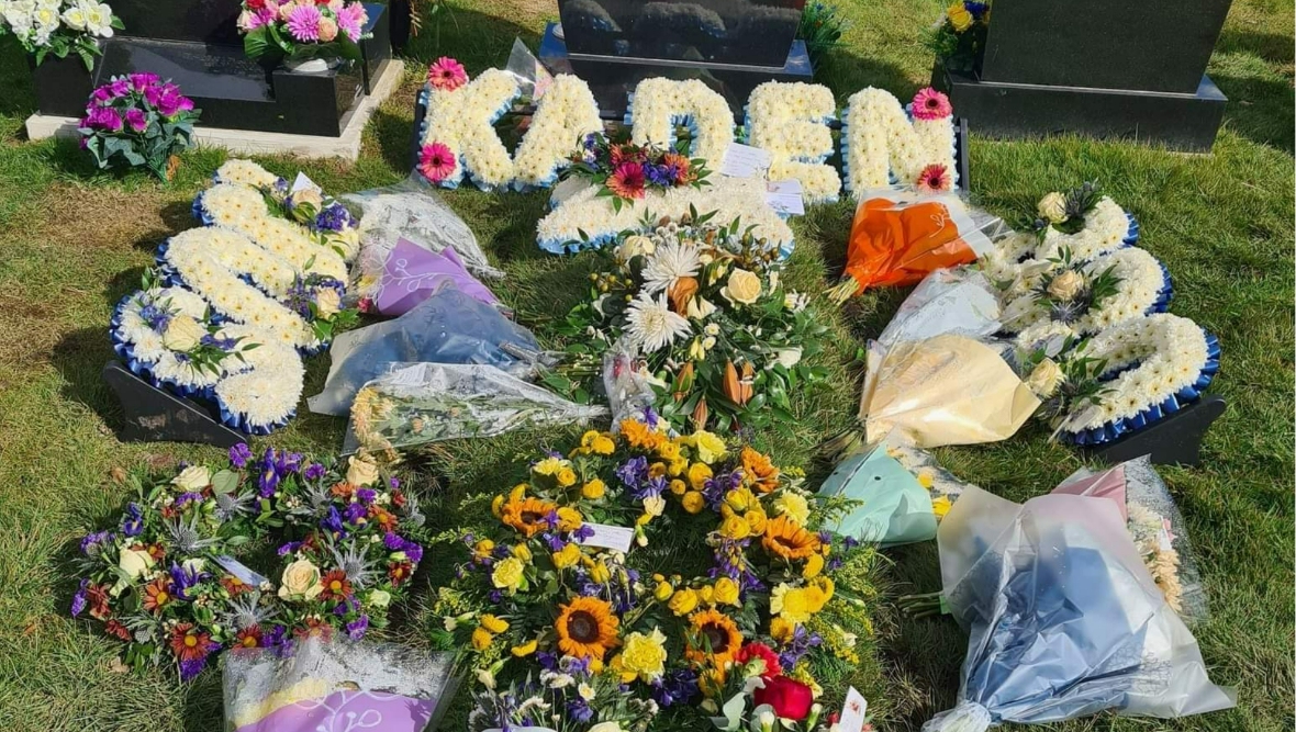 Floral tributes at Kaden's graveside.