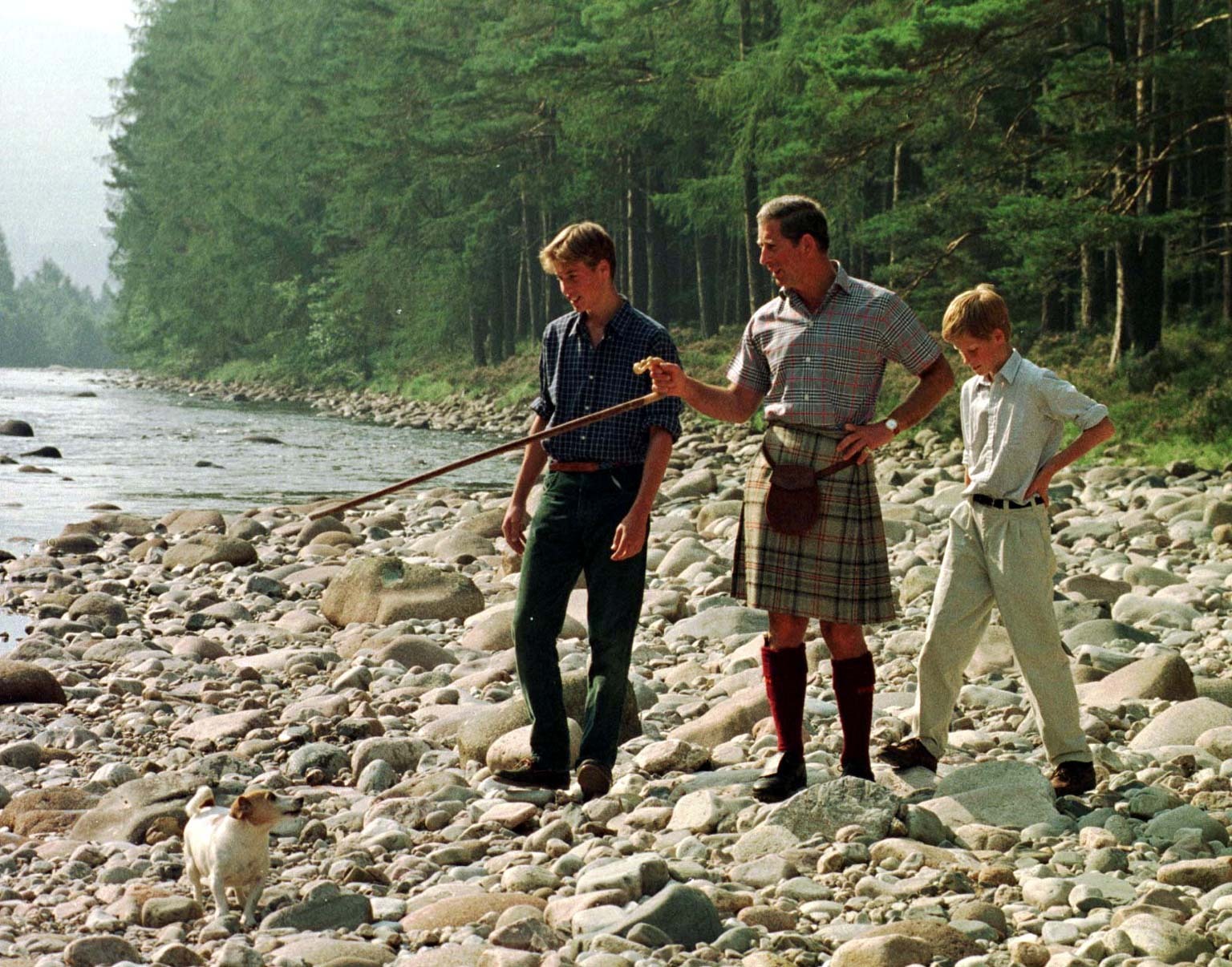 The Prince of Wales and his sons William, 15, and Harry, 12, take an early morning walk along the banks of the River Dee on the Balmoral estate in 1997.