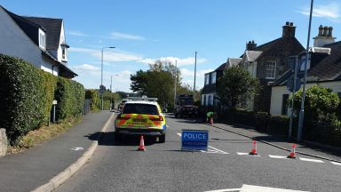 Man airlifted to hospital following crash between car and motorbike in Ayrshire