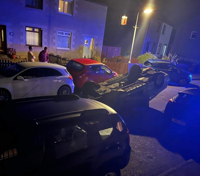'Pure carnage' Man arrested after car landed on its roof in crash at
