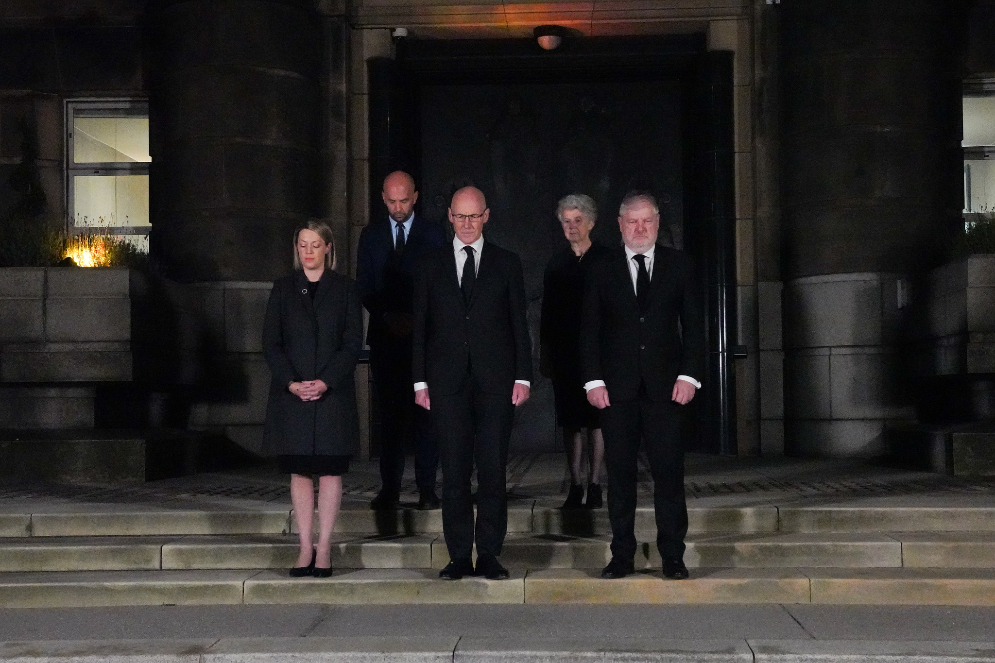 John Swinney and Scottish ministers mark the minute's silence.