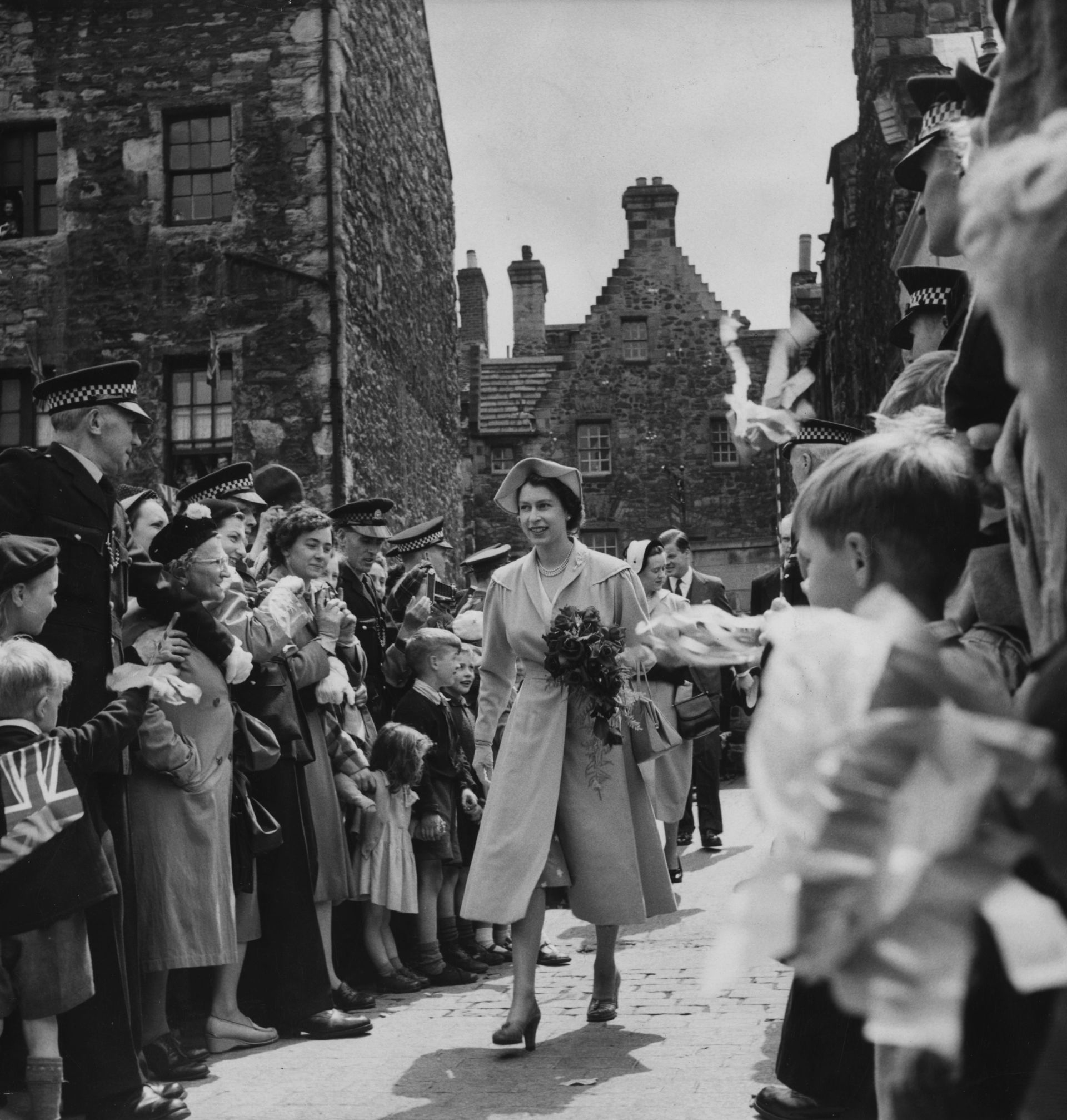 July 12, 1952:  Queen Elizabeth II on a visit to the Scottish Craft Centre, Edinburgh. The royal visit was the first by a reigning monarch in 50 years and also the first time Queen Elizabeth II had stayed at the Palace. 